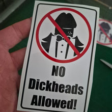 Load image into Gallery viewer, Sticker with a crossed-out face icon and 'No Dickheads Allowed!' text held by a hand.