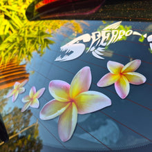 Load image into Gallery viewer, Floral yellow frangipani decals on a car window with a scenic background