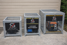 Load image into Gallery viewer, Three metal equipment cages with 'Stick-Dat' branding on a concrete surface.