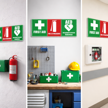 Load image into Gallery viewer, First aid kits and safety signs in various settings including a warehouse, workshop, and medical facility.