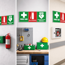 Load image into Gallery viewer, First aid kits and safety signs in various settings including a warehouse, workshop, and medical facility.