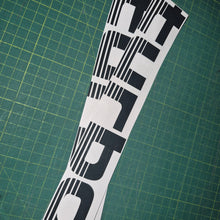 Load image into Gallery viewer, Turbo decal on a green cutting mat