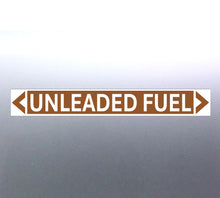 Load image into Gallery viewer, A pipe marker sign with the text 'UNLEADED FUEL' in bold black lettering on a golden tan background with a white border and green arrows indicating flow direction.