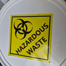 Load image into Gallery viewer, White container lid with a hazardous waste label featuring a biohazard symbol.