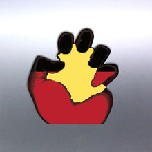 Load image into Gallery viewer, A aboriginal vinyl sticker featuring a black fist flag design with a yellow sun in the center Decal on a silver car door
