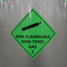 Load image into Gallery viewer, Close-up on compressed gas cylinder