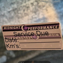 Load image into Gallery viewer, Service due sticker on a glass surface with a blurred background