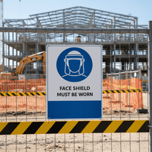 Load image into Gallery viewer, Face Shield on construction fence