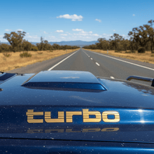 Load image into Gallery viewer, Gold Turbo sticker on diesel 4WD bonnet scoop