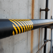 Load image into Gallery viewer, Hazardous marker on black steel pipe