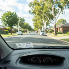 Load image into Gallery viewer, Inside car windscreen view with service due sticker on glass