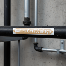 Load image into Gallery viewer, Natural Gas pipe marker on black steel pipe