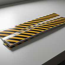 Load image into Gallery viewer, Pack of stickers on bench