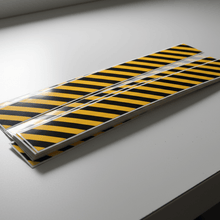 Load image into Gallery viewer, Pack of stickers on bench