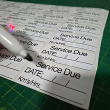 Load image into Gallery viewer, Service due card with a marker on a green cutting mat