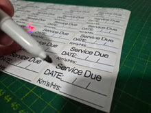 Load image into Gallery viewer, Service due card with a marker on a green cutting mat