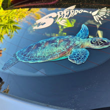 Load image into Gallery viewer, Turtle decal on a car window with another decal above it.