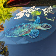 Load image into Gallery viewer, Car window with a large sea turtle decal and smaller butterfly decal.