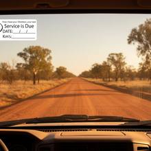 Load image into Gallery viewer, Service due sticker on dusty 4WD outback