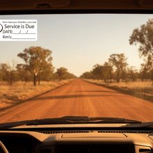 Load image into Gallery viewer, Service due sticker on dusty 4WD outback