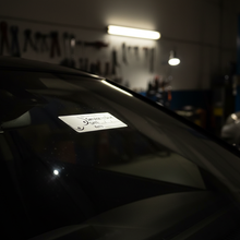 Load image into Gallery viewer, Service due sticker on windscreen at night