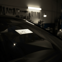 Load image into Gallery viewer, Service due sticker on windscreen at night