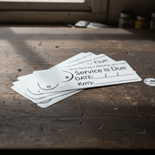 Load image into Gallery viewer, Sheet of novelty service due stickers on workshop bench