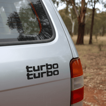 Load image into Gallery viewer, Small silver turbo sticker on 4WD rear tailgate