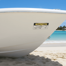 Load image into Gallery viewer, Spearo Caution on Boat on Beach