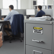 Load image into Gallery viewer, Sticker on filing cabinet