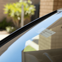 Load image into Gallery viewer, Sticker on windscreen outside looking in