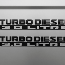 Load image into Gallery viewer, Two black Turbo Diesel 3.0 Litre stickers stacked