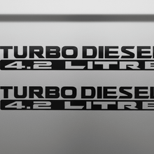 Load image into Gallery viewer, Two black Turbo Diesel 4.2 Litre stickers stacked
