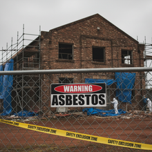 Load image into Gallery viewer, Warning Asbestos on chain-link fence