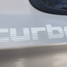 Load image into Gallery viewer, White 100 Series Turbo sticker on white vehicle panel