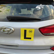 Load image into Gallery viewer, Hyundai car with a yellow learner's license plate on the back