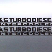 Load image into Gallery viewer, two black vinyl decals with the text '6.5 TURBO DIESEL INTERCOOLED' stacked vertically, shown on a gray metallic surface.
