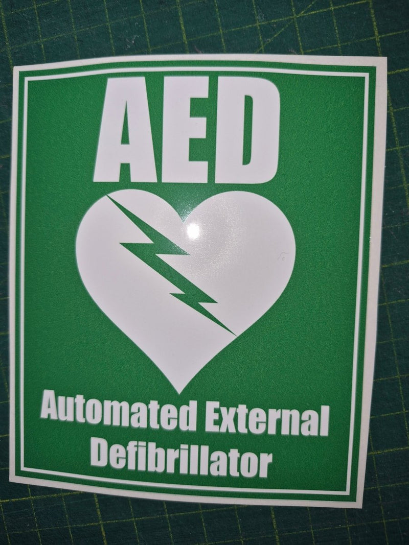 AED Automated External Defibrillator sticker on a green background
