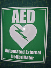 Load image into Gallery viewer, AED Automated External Defibrillator sticker on a green background
