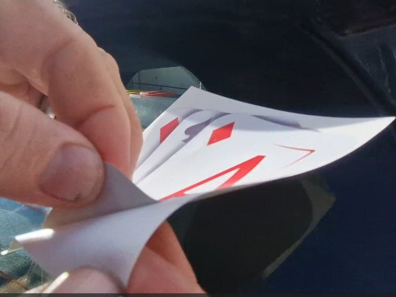 Hand holding playing cards with a blurred background