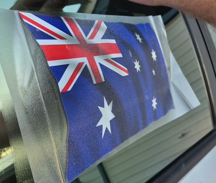 Australian flag decal on a car window