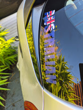 Load image into Gallery viewer, Car window with 'AUSTRALIAN' decal featuring Australia flag, reflecting greenery.
