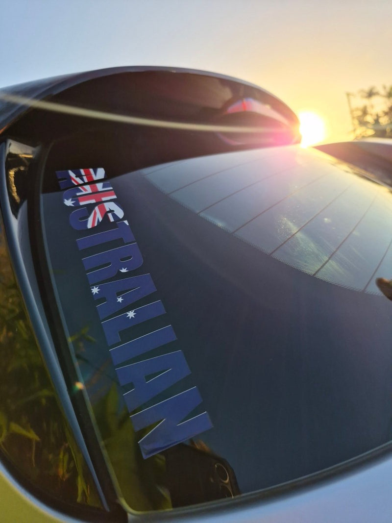 Reflective surface with 'AUSTRALIAN' text and flag design, sunlit outdoors.