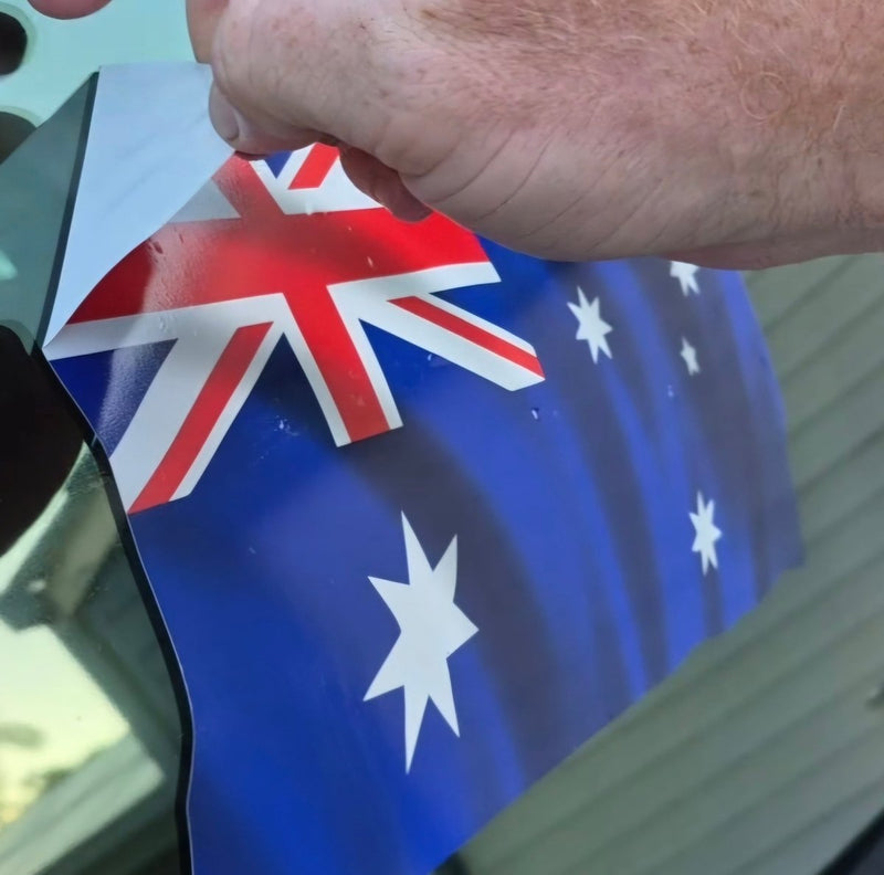 Hand holding an Australian flag sticker
