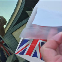 Load image into Gallery viewer, Person holding a clear allocation tape with a Union Jack design, australuan flag decal
