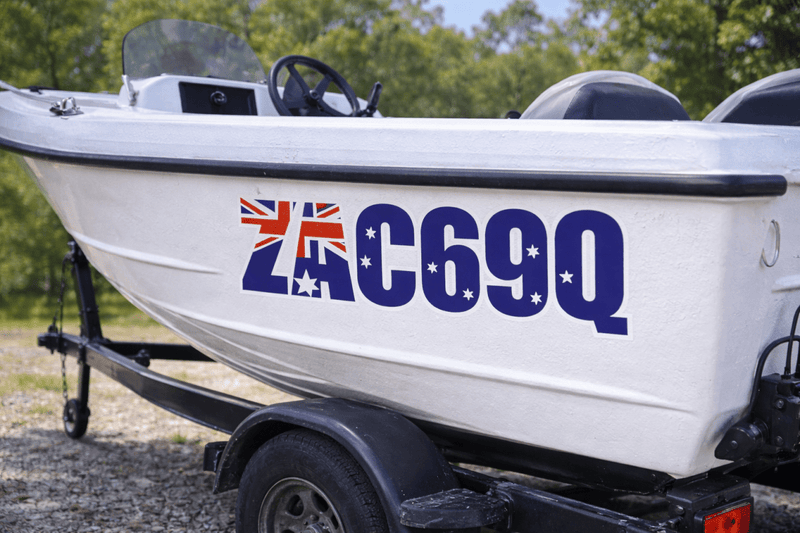 White boat with registration number C69Q on a trailer