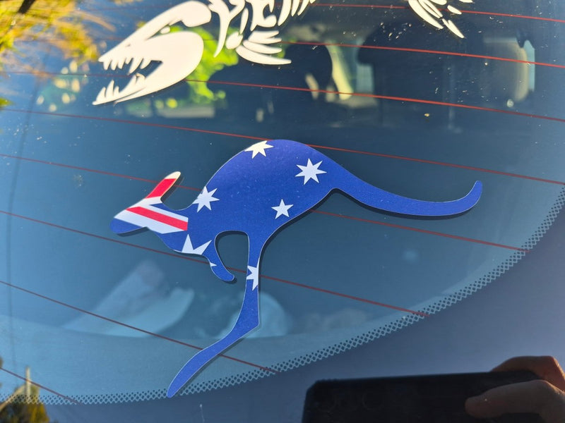 Kangaroo-shaped decal with Australian flag design on a car window