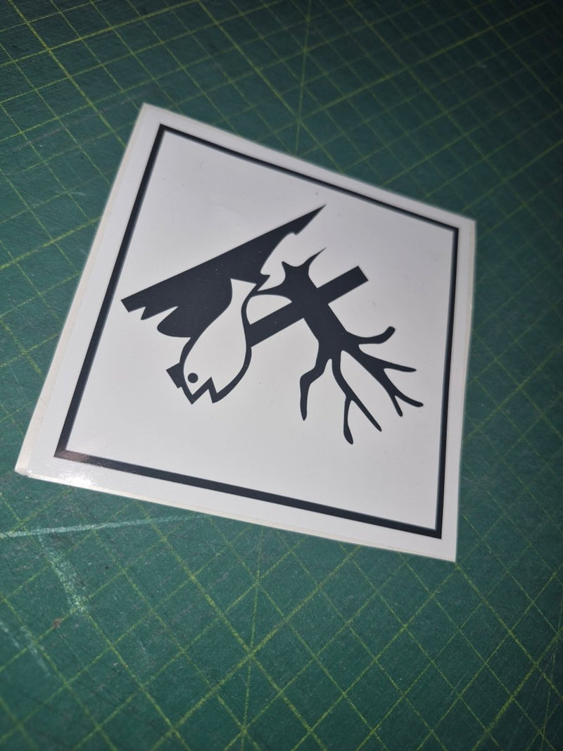 Black and white sticker with deer design on a green cutting mat