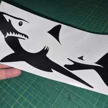 Load image into Gallery viewer, Black shark decal on a white card held over a green cutting mat
