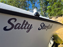 Load image into Gallery viewer, custom Boat name decal;  'Salty Starfish' with trees and clear sky in the background, made in australia
